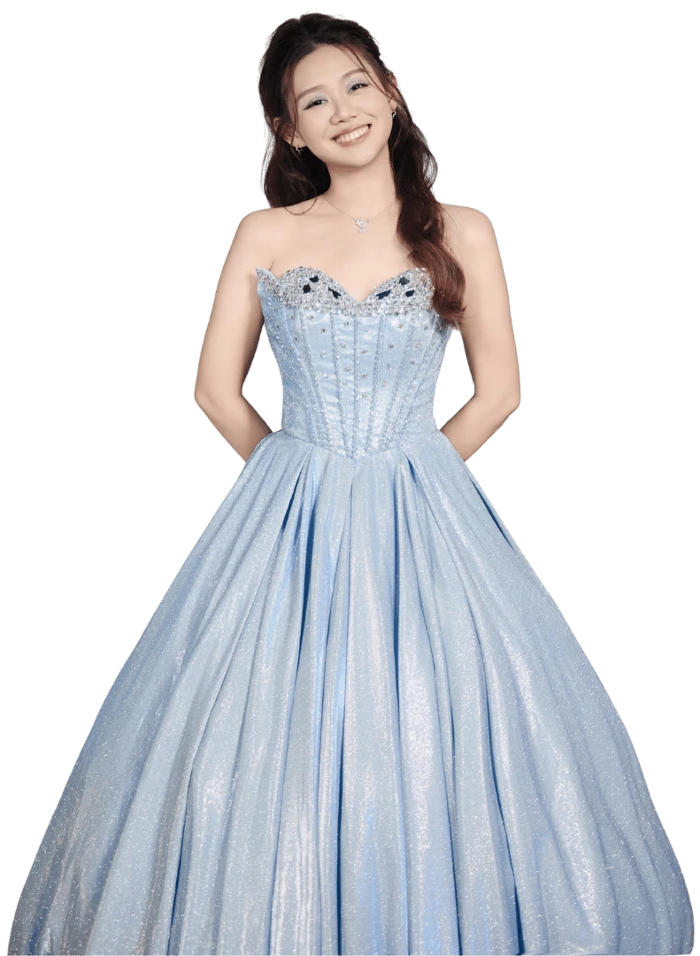 Eugenie Hang smiling in a pale blue gown